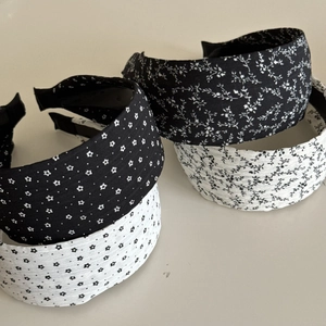 Four-piece wide headband set featuring black and white floral and star patterns