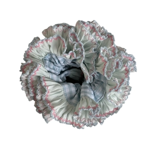 Floral ruffle scrunchie with pastel pink and blue wavy edges and a classic gingham pattern