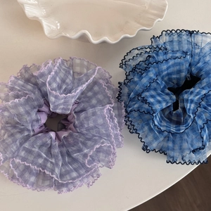 Chiffon blue and purple plaid oversized scrunchies set with wavy edges on white surface