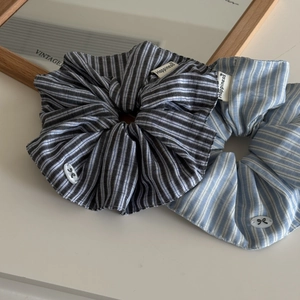 Blue and grey striped fabric hair scrunchies with white bow button and happiness label