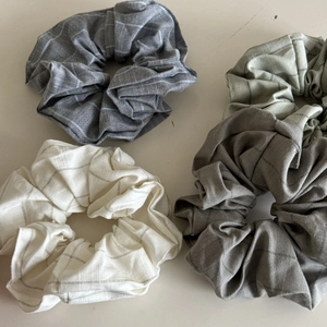 Set of four minimalist striped scrunchies in gray, beige, green, and brown tones