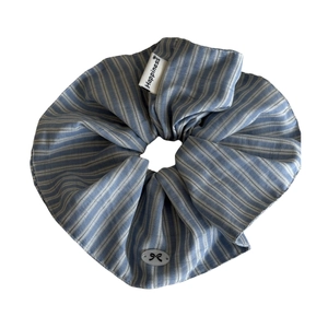 Blue and white striped scrunchie with Happiness woven label and bow accessory