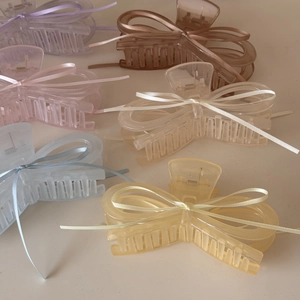 Pastel macaron acrylic hair claws with ribbon bow design in various colors for women