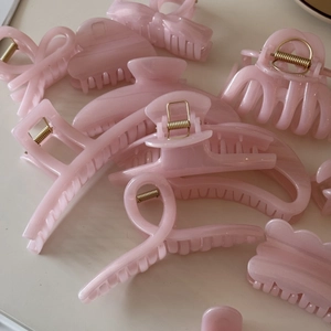 Pink shimmering jelly hair claw clips in bow, heart, and crescent shapes set