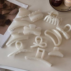 Set of 11 creamy white jelly shimmer hair claws in various elegant minimalist designs