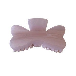 Pink jelly butterfly hair claw clip with subtle shimmer and translucent pearl finish