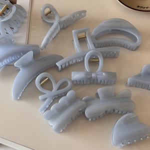 Blue jelly glitter hair claw clips set in various shapes for elegant hair styling