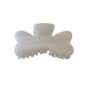 Elegant cream white jelly hair claw clip with subtle shimmer and wavy edge design