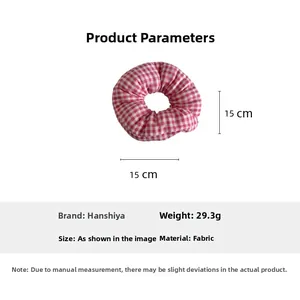 Detail of red and white checkered fabric scrunchie showing 15cm size and 29.3g weight specs
