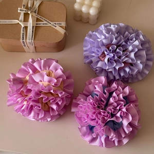 Three-piece set of handmade ruffled carnation hair scrunchies in pastel purple and pink