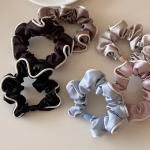 Elegant satin hair scrunchies with white contrast edges in assorted retro colors