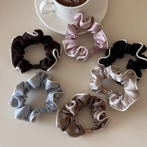 Set of 6 French satin scrunchies with white contrast piping for elegant hair styling