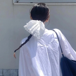 White lace hollow embroidery hair scrunchie with layered design on ponytail hairstyle