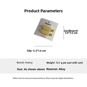 Detailed view of yellow alloy hair clips with pink stitching on white card base