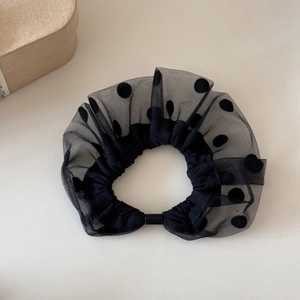 Detail of black mesh hair scrunchie with flocking polka dots and high elastic inner band
