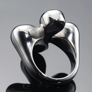 Modern minimalist black mirror finish stainless steel ring with a fluid streamlined design
