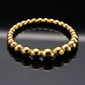 Minimalist golden beaded stainless steel ring with gradient beads and polished finish