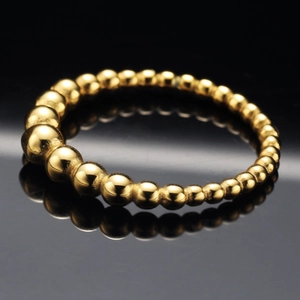 Minimalist gold beaded stainless steel ring with gradient sphere design and polished finish