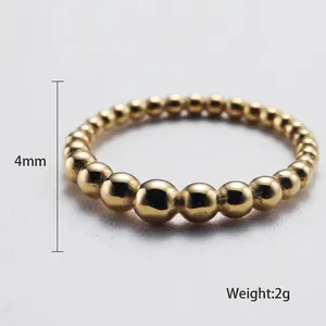 Minimalist gold beaded stainless steel ring with polished gradient spheres and 4mm height