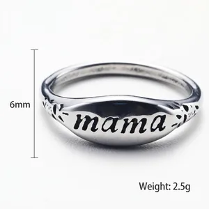 Minimalist stainless steel ring featuring engraved mama letters and flame patterns on silver metal