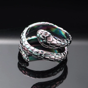 Macro shot of rainbow-plated titanium snake ring with detailed scale texture
