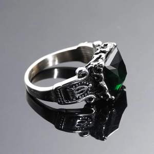 Vintage gothic crown ring in aged silver with a large emerald-cut green stone
