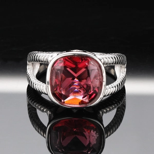 Fashionable stainless steel ring with square pink gemstone and twisted cable design