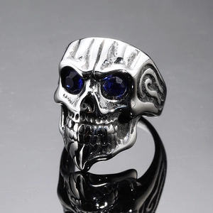 Punk style stainless steel skull ring featuring blue zircon eyes and vintage silver finish