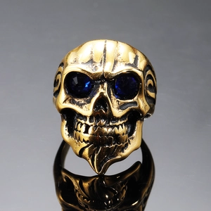 Men's punk skull ring in gold stainless steel with blue stone eyes and vintage finish