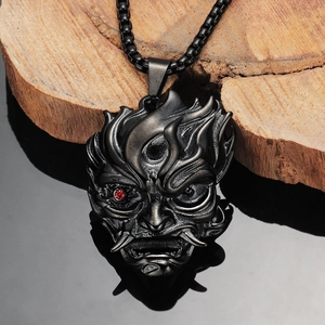 Japanese Hannya mask pendant in black metal with red stone eye on square chain