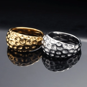 Polished gold and silver geometric stainless steel rings with hammer textured concave dots
