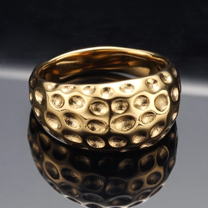 Minimalist wide gold geometric ring with hammered texture and mirror reflection