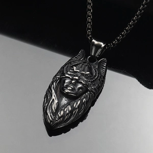 Detailed relief of a masked catwoman pendant on a vintage steel box chain