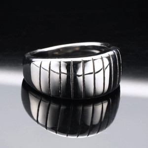 Minimalist wide band stainless steel ring with vertical black and silver grooved stripes