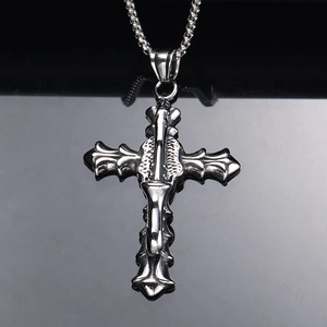 Detailed macro view of vintage gothic cross pendant with intricate embossed textures