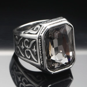 Macro shot of men's titanium steel ring with large rectangular gray gemstone inlay