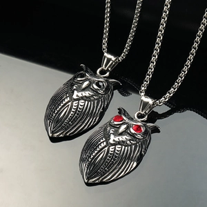 Vintage owl pendant necklace in stainless steel with red and black eye details