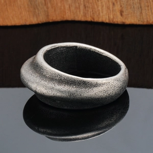 Vintage oxidized silver oval titanium ring with textured finish and wide geometric surface