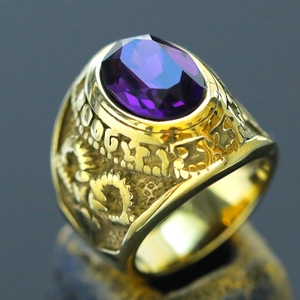 Detail of vintage gold ring featuring a large faceted purple amethyst oval stone