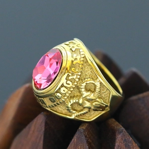 Detail shot of vintage gold-plated steel ring with a large oval pink gemstone