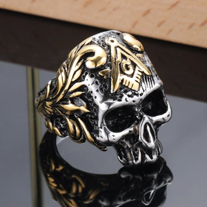 Vintage stainless steel skull ring with golden Freemasonry logo and textured finish