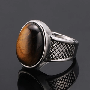 Men's vintage titanium steel ring featuring a polished oval tiger eye stone inlay