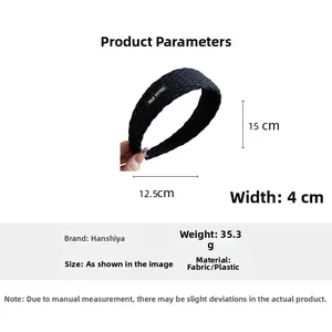 Detail view of black knitted headband with 4cm width and TRUE FITTED logo patch