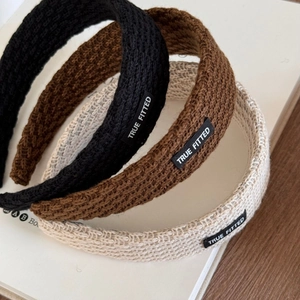 Three-piece knitted wide headband set in black, brown, and beige with letter patches