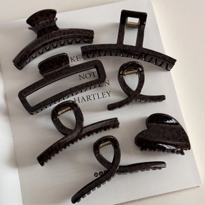 Brown leopard pattern hair claw clips set in various shapes with shiny resin finish