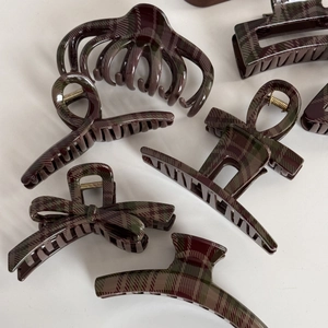 Deep red and green plaid hair claw clip set with vintage British style resin patterns