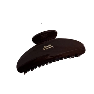 Chocolate brown large shark clip with gold Barrette LaFrance lettering and glossy finish