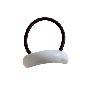 Minimalist elastic hair tie with curved white resin detail and black braided cord