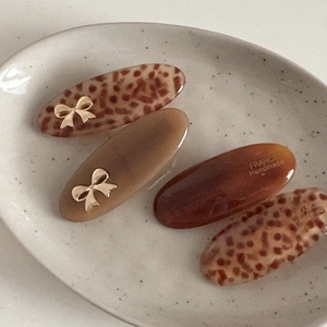 French acetate bow hair clips set with leopard print and tortoise patterns