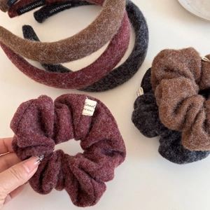 Close-up of plush handmade scrunchie and headband with soft mohair fabric texture